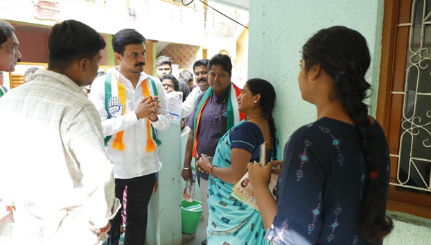 Campaigned for votes on behalf of Congress party by visiting houses in Sanjeevininagar in Moodalapalya ward 127