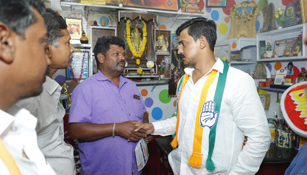 Campaigned for votes on behalf of Congress party by visiting houses in Sanjeevininagar in Moodalapalya ward 127