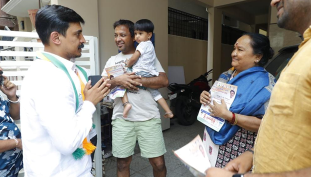 Campaigned for votes on behalf of Congress party by visiting houses in Sanjeevininagar in Moodalapalya ward 127